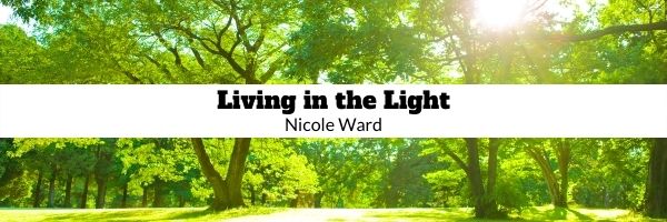 Background of light coming through forest canopy, black text, Living in the Light, Nicole Ward